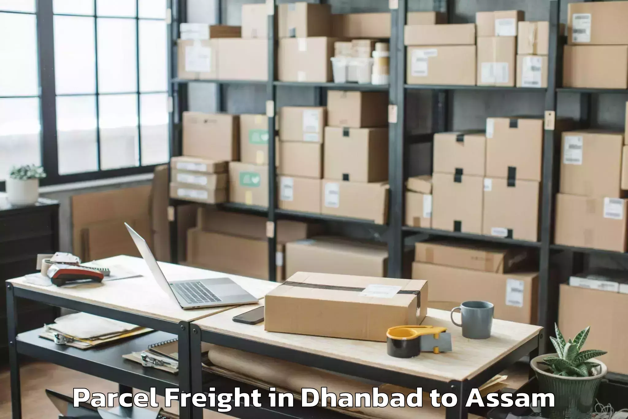 Book Dhanbad to Bihpuria Parcel Freight Online